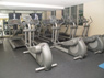 State of the art fitness center with exercise machines and TVs