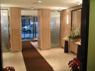 Elegant glass and white washed maple lobby