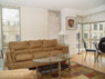 Open living, dining area with wood floors